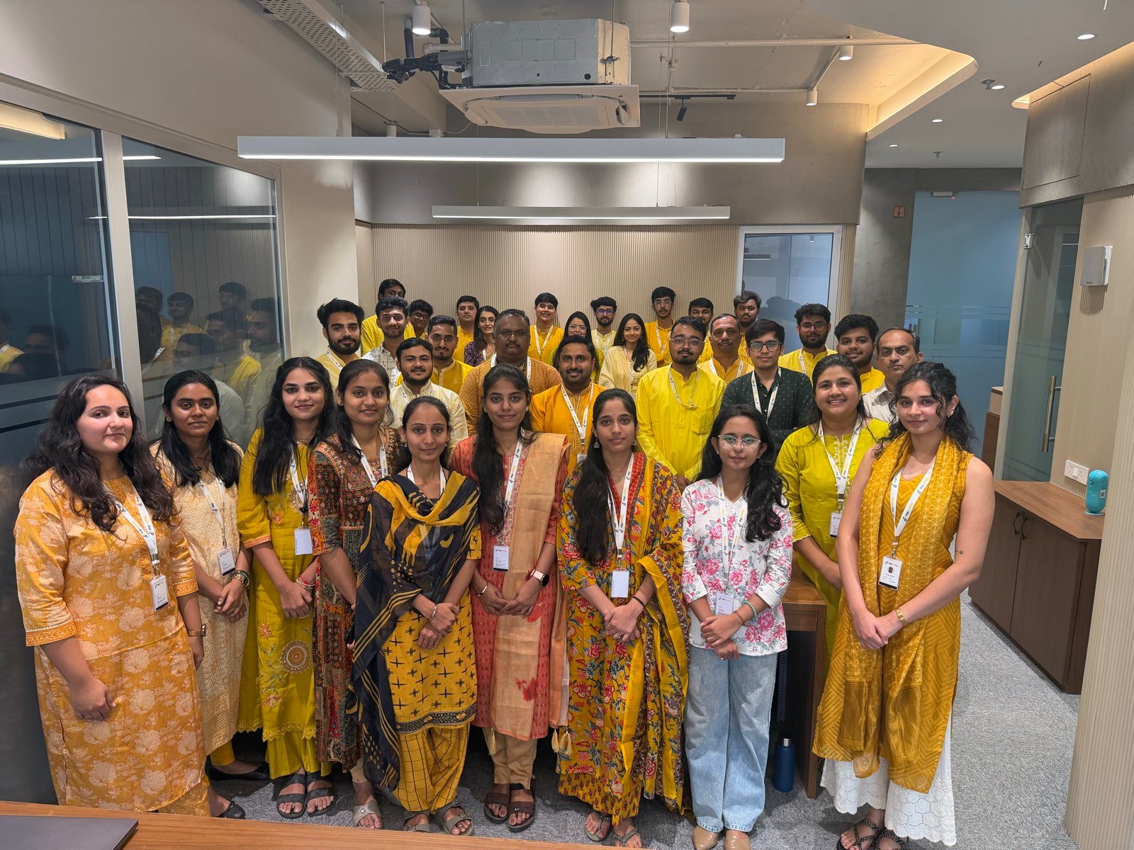 The DigiProdigy team together in the office, dressed in yellow